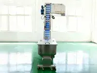 Elevador y alimentador de tapas automático