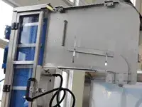 Elevador y alimentador de tapas automático