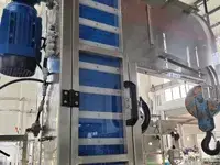 Elevador y alimentador de tapas automático
